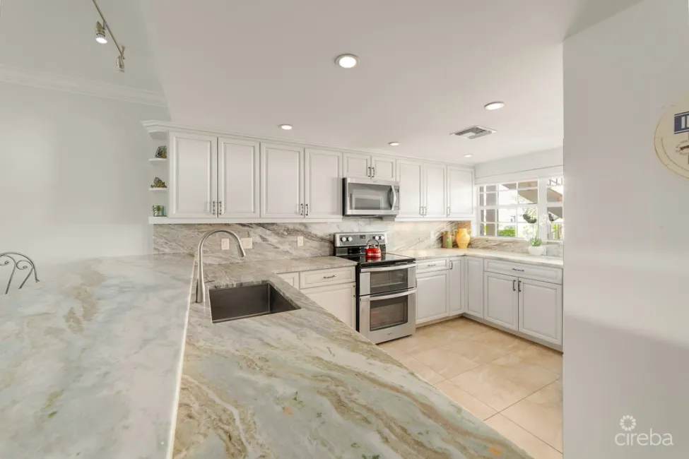 BRITANNIA LIONS COURT UNIT #213 - 1-BEDROOM GARDEN VIEW CONDO