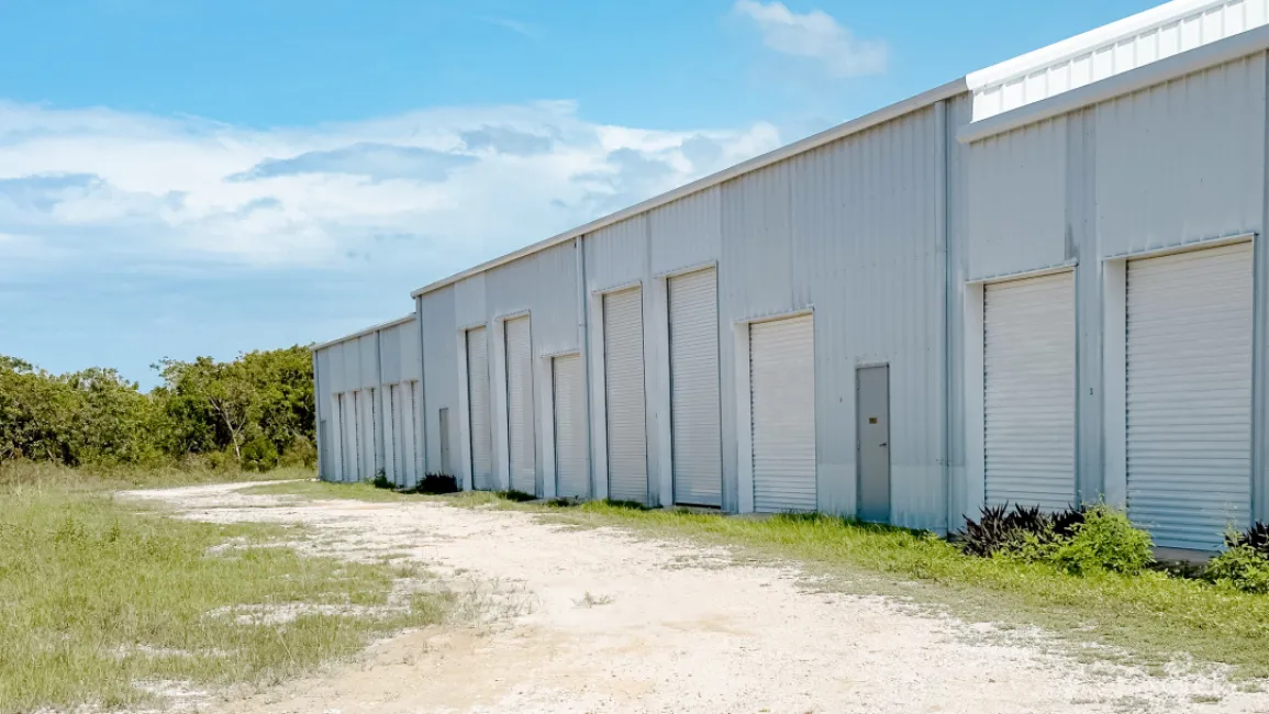 LITTLE CAYMAN WAREHOUSE (20 UNITS) AND LAND SUB-DIVISION 13 LOTS