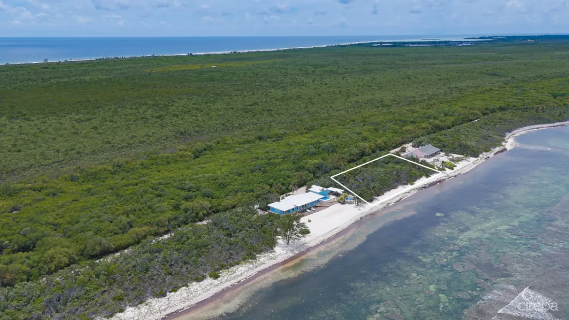 LITTLE CAYMAN BEACHFRONT HOME WITH 2 LOTS AND POOL