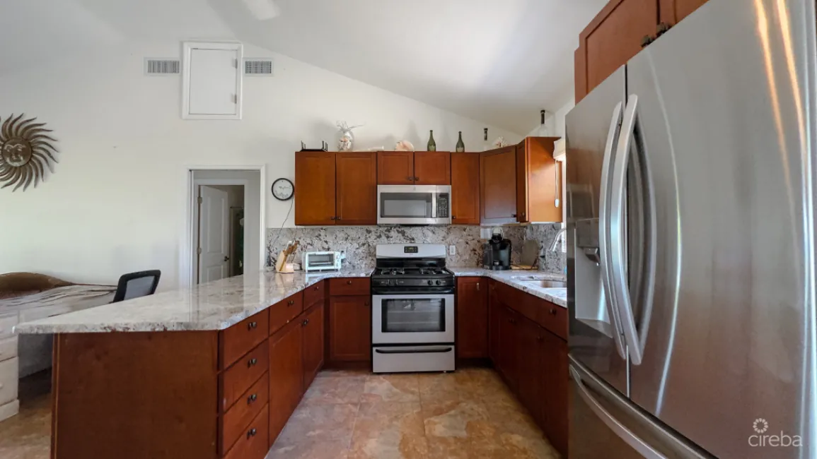 LITTLE CAYMAN OCEAN VIEW RESIDENTIAL HOME WITH BEACHFRONT LOT