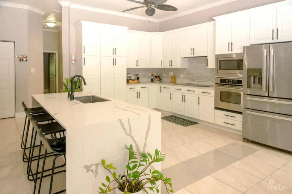 KITCHEN WITH PLENTY OF ADDITIONAL STORAGE AND A BUILT IN PANTRY - 4 BEDROOM BEAUTIFUL FAMILY HOME IN SAVANNAH