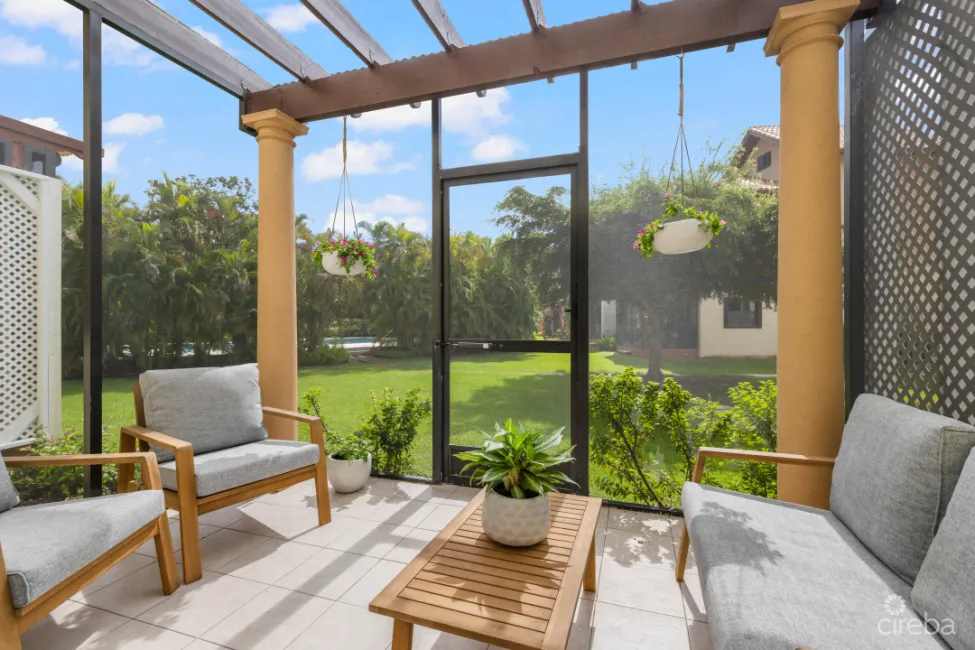 Comfortable, breezy patio with new screens and rooftop.