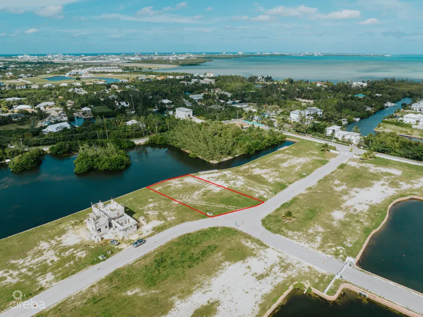 MUSTIQUE COVE - LARGE 0.31 ACRE CANAL LOT