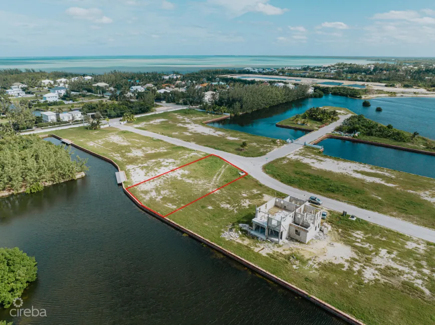 MUSTIQUE COVE - LARGE 0.31 ACRE CANAL LOT